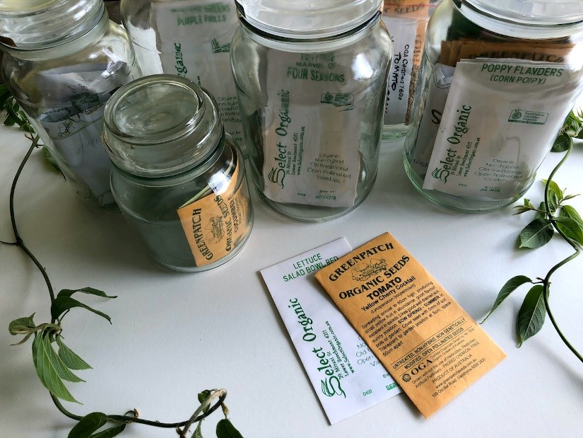 Seed packets inside glass jars