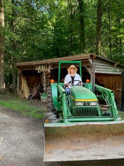 woman driving tractor